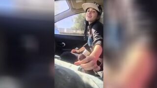 Passenger masturbating the car driver who agrees to give her a ride.
