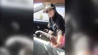 Passenger masturbating the car driver who agrees to give her a ride.