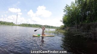 Big-Ass Blonde Rides a SUP Board Naked on a Beach