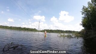 Big-Ass Blonde Rides a SUP Board Naked on a Beach